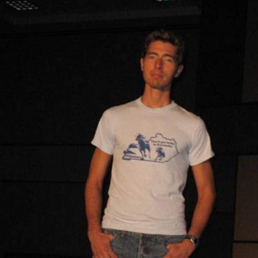 Male student/model walking down the runway at the fashion show.
