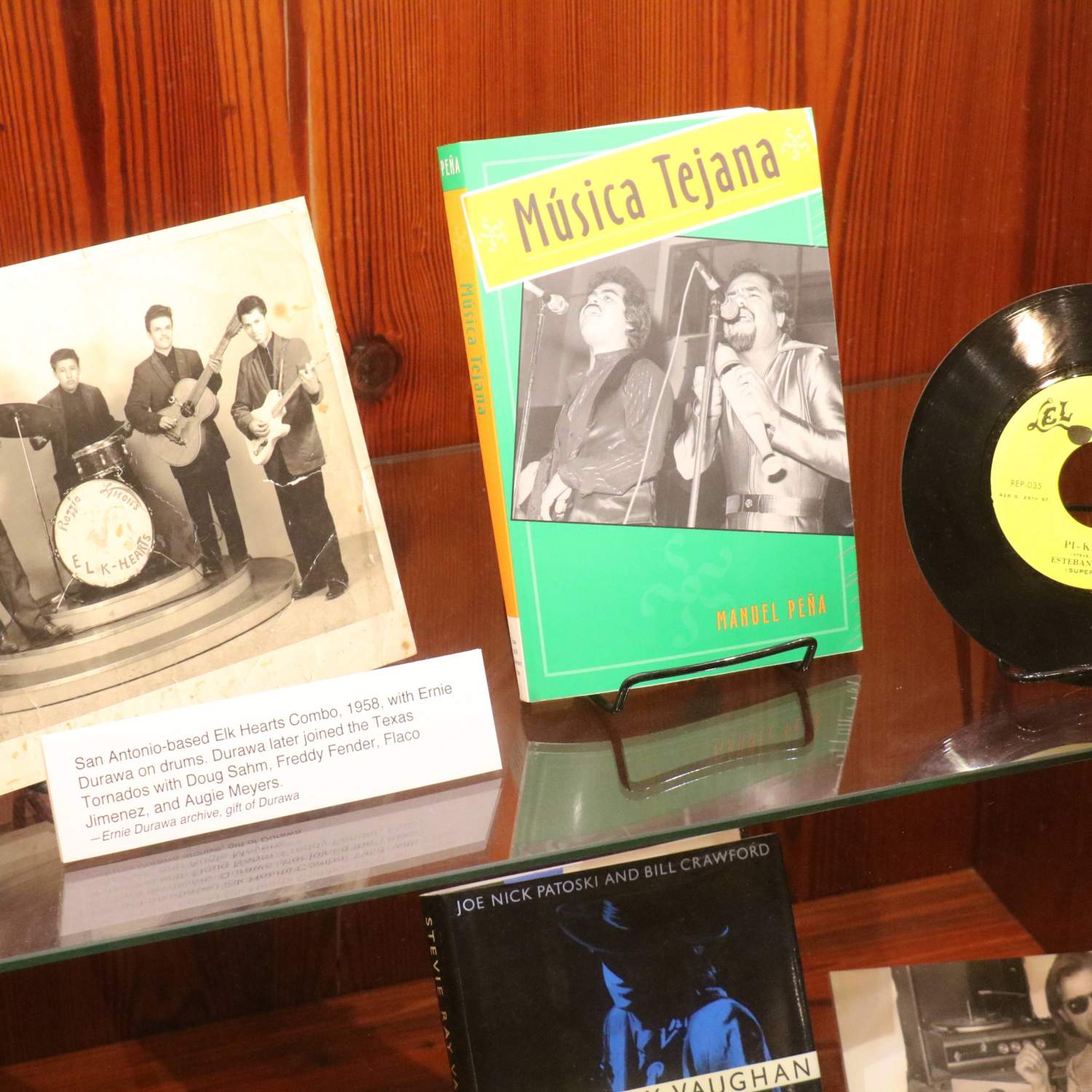 Photo of display case with music memorabilia