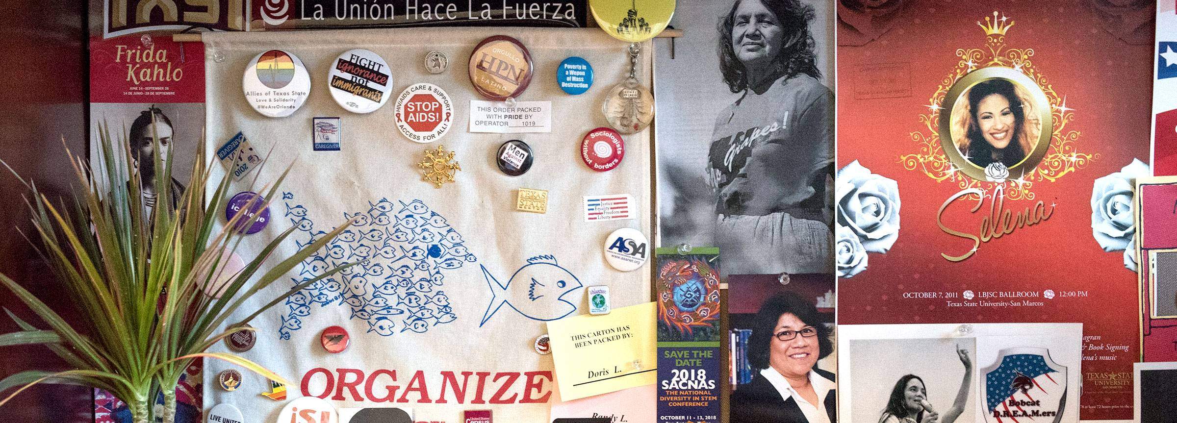 a collection of items and keepsakes related to the Latinx community including buttons and photographs