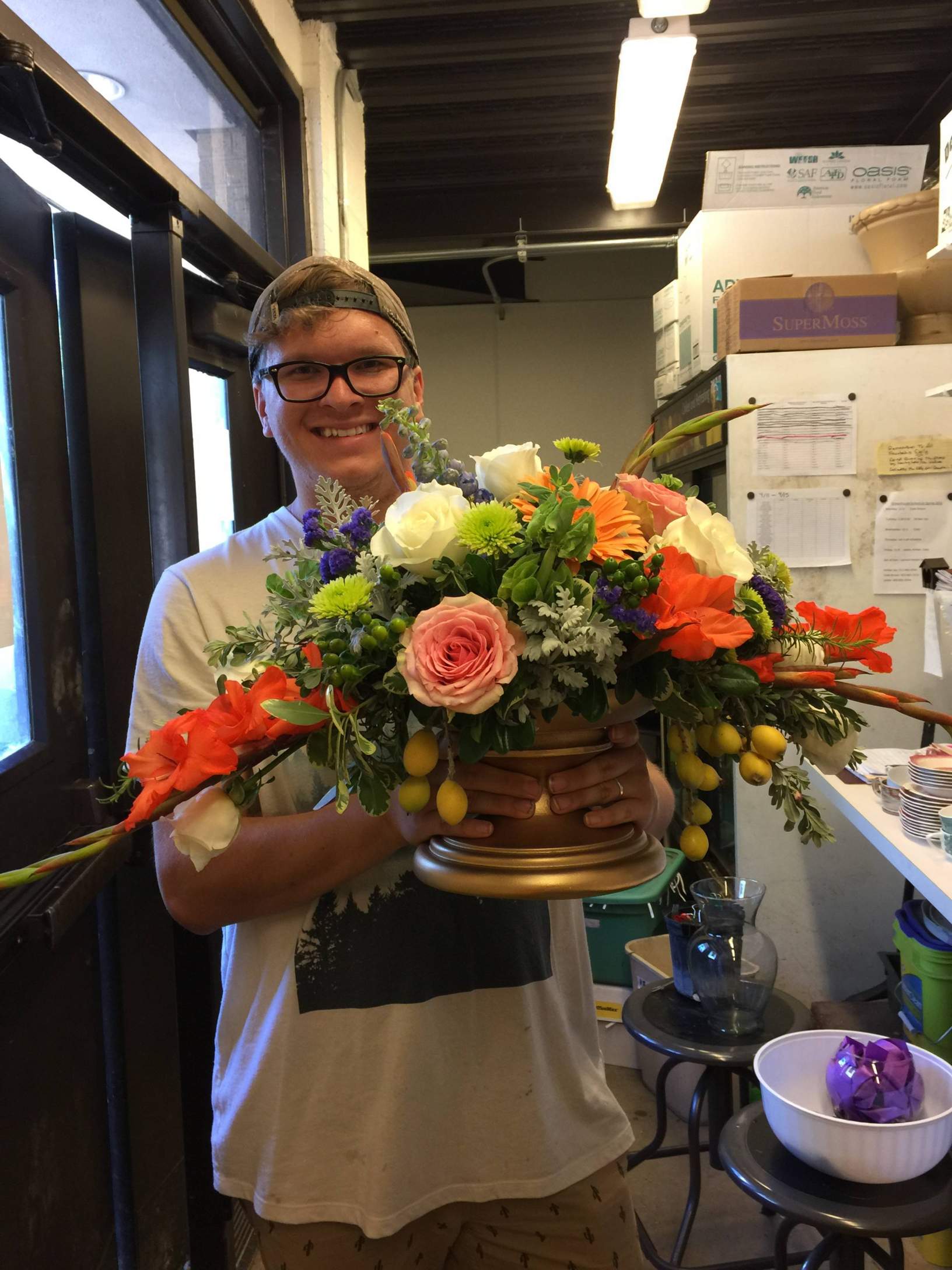 student holding large bouquet 