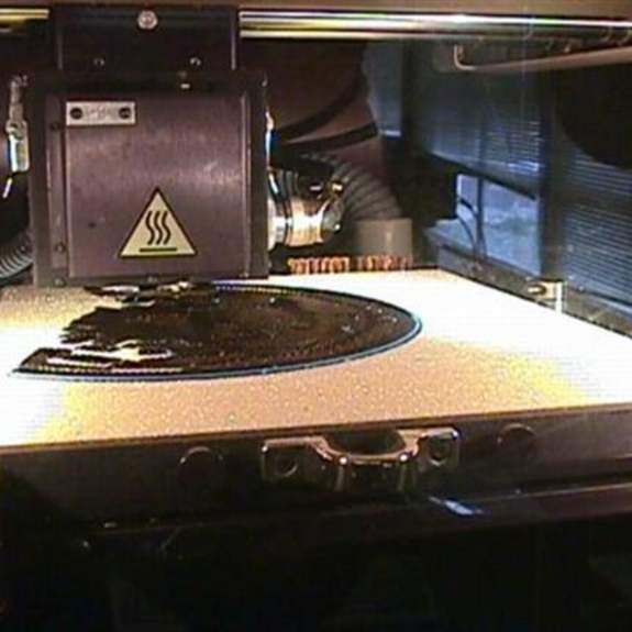 Image, inside base of 3D printer, hot plate.