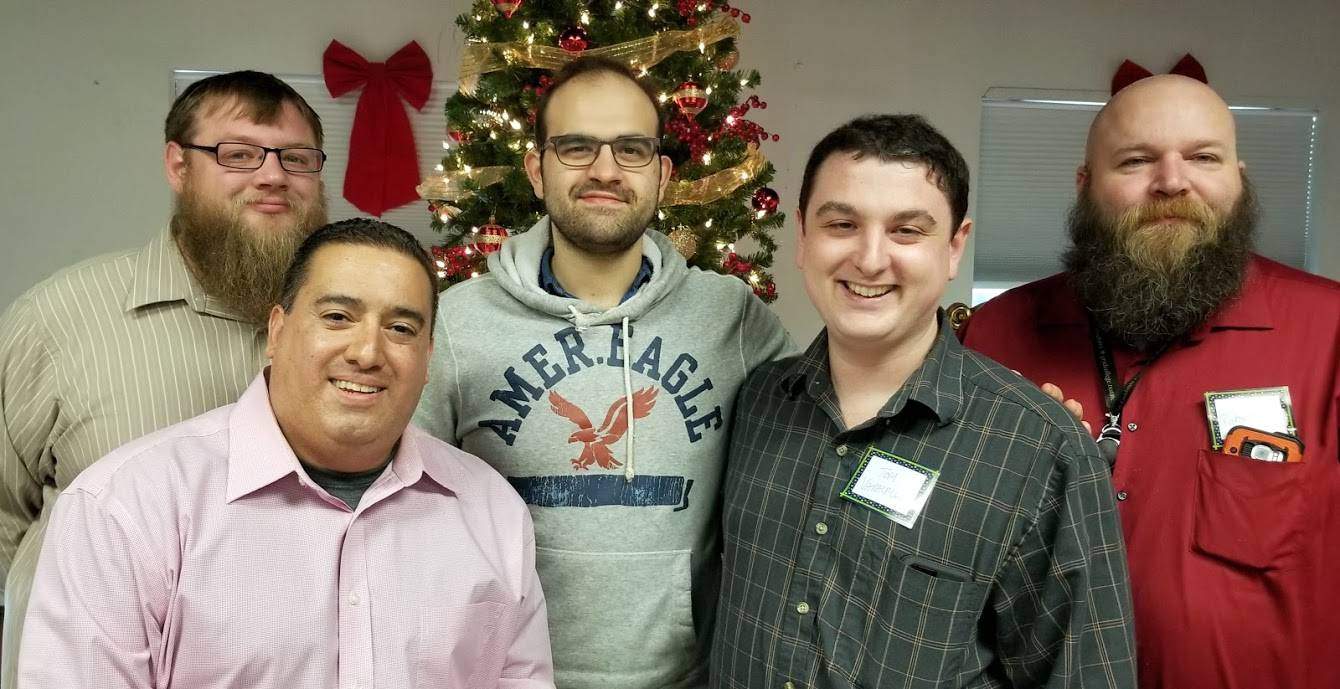 Dr. Varacalli and graduate students at the holiday party