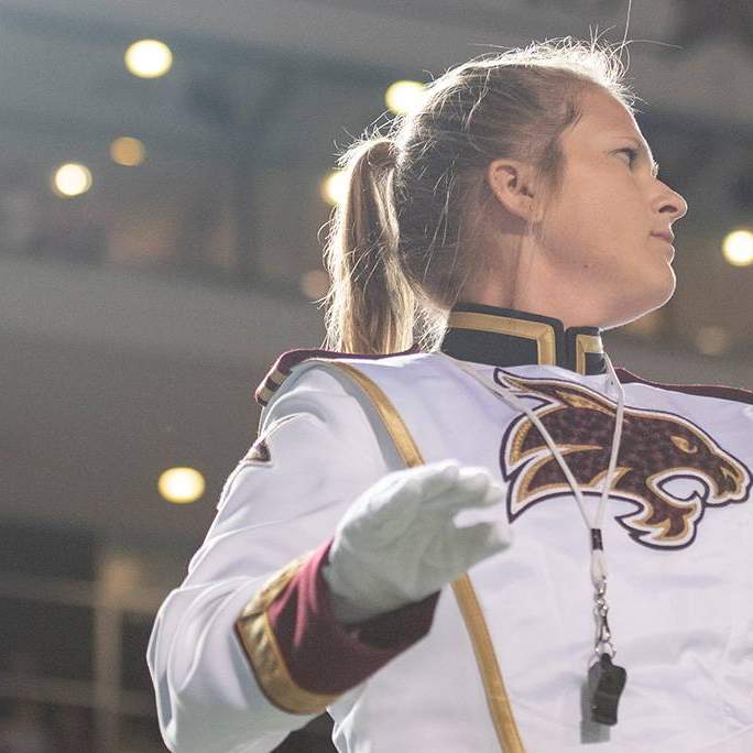drum major Bethany Smith directs marching band halftime show at Bobcat Stadium
