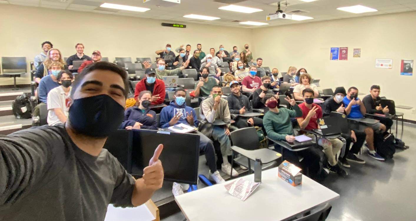 man taking selfie with class
