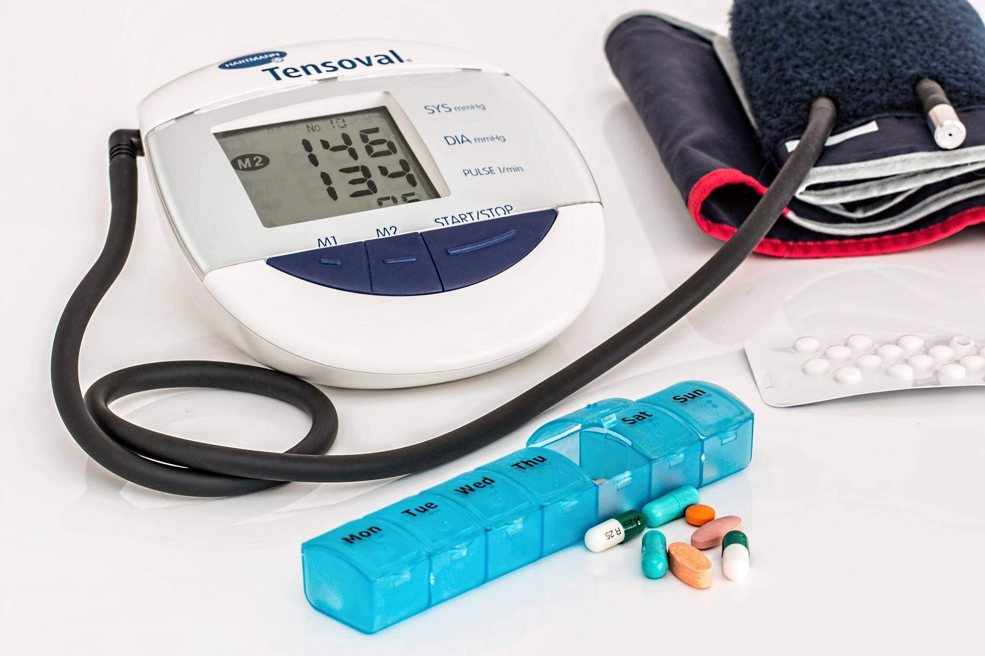 blood pressure machine and weekly pill container on countertop