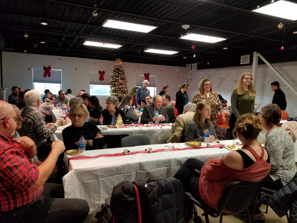 Staff and Family gathered for the holiday party