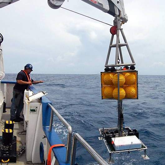 The crew of the Exploration Vessel Nautilus recover an undersea “elevator” which carrying artifacts from the wreckage of an early 19th century shipwreck recently documented and partially excavated in the Gulf of Mexico in more than 4,300 feet of water.  The wreck is one of three sites investigated by scientists from the Bureau of Ocean Energy Management, the National Oceanic and Atmospheric Administration, the Bureau of Safety and Environmental Enforcement, the Texas Historical Commission, and the Meadows Center for Water and the Environment at Texas State University.  The project was funded by donations and sponsorships arranged by the Meadows Center, and conducted in partnership with the Ocean Exploration Trust at the University of Rhode Island on board the Exploration Vessel Nautilus. Photo by Alan Franks, Ocean Exploration Trust/Meadows Center for Water and the Environment, Texas State)