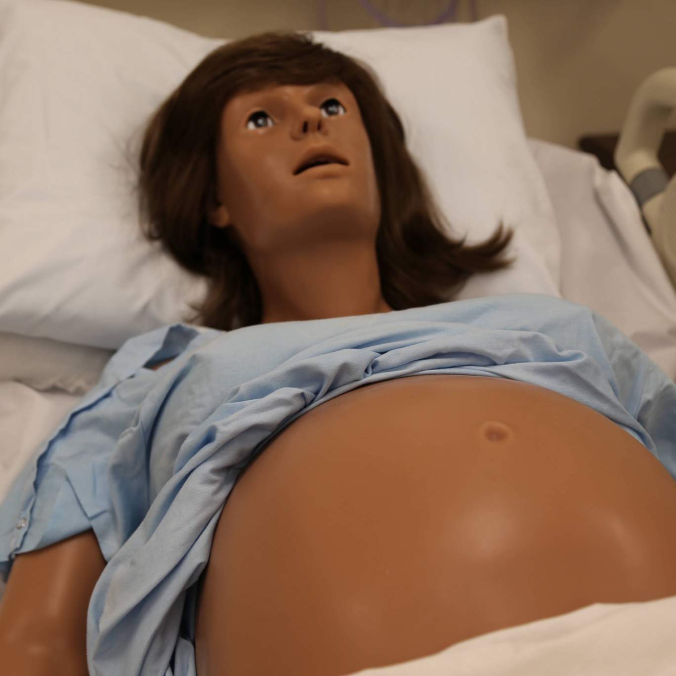 Manikin with belly exposed