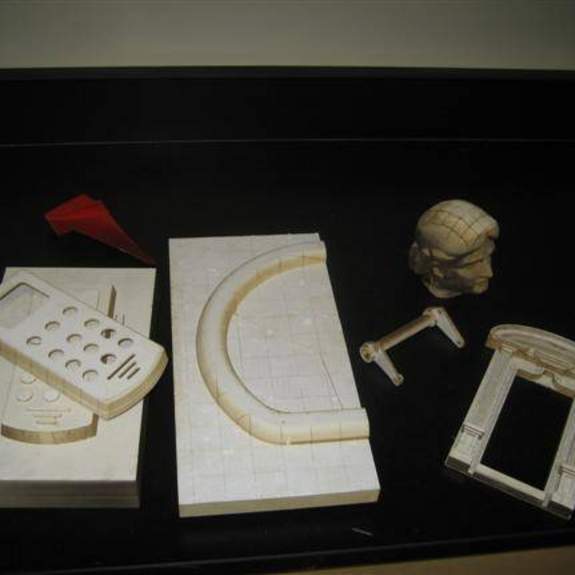 Image, various 3D parts that look wooden.