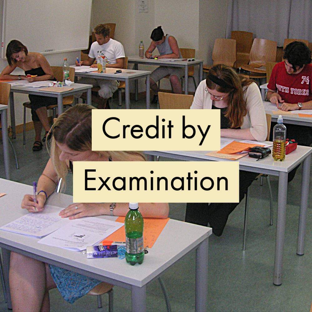 Text: Credit by Examination. Image: students taking an exam at the University of Vienna