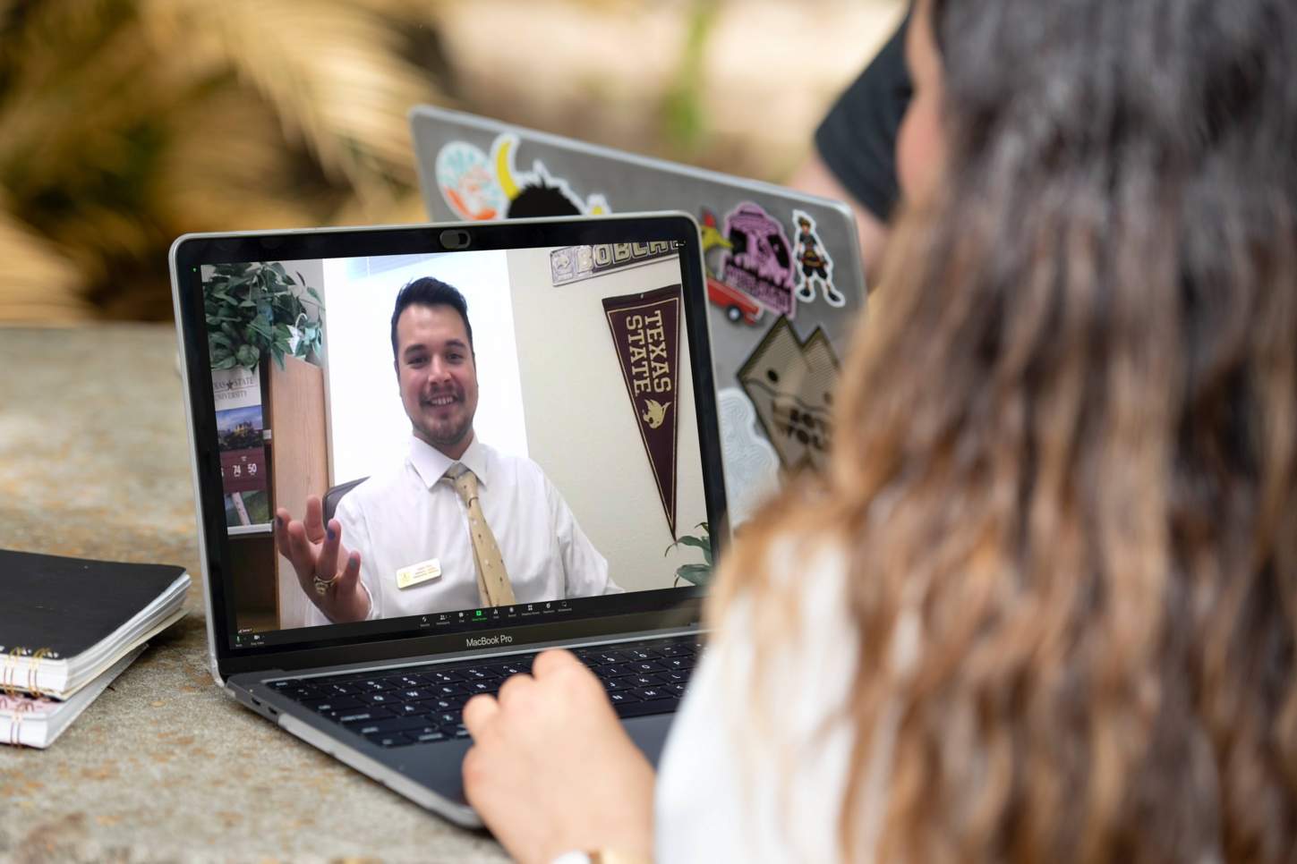 Student meeting with an admissions counselor on video chat.