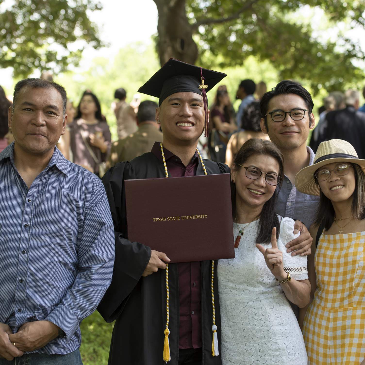 graduate and family in Sewell Park