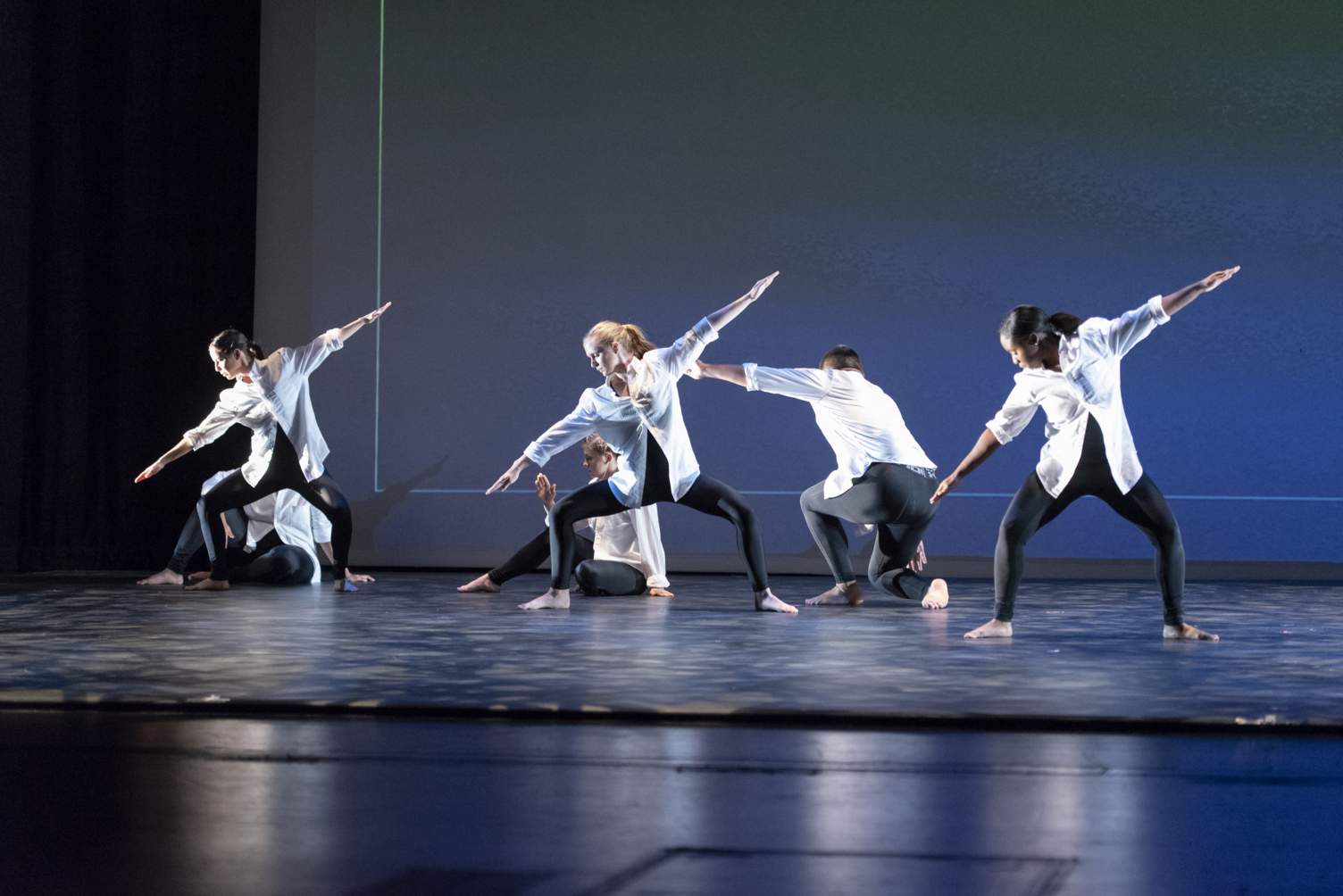 Dance students in white shirts and black pants at Texas State University