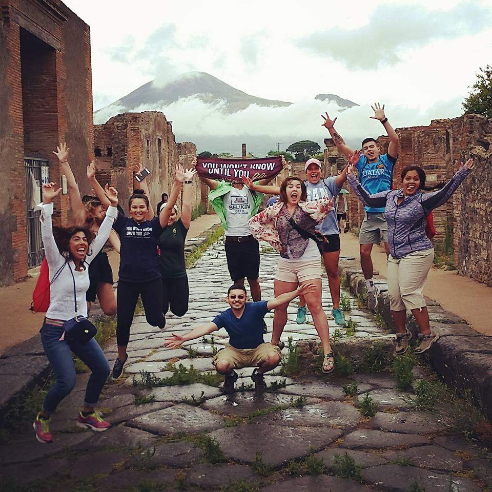 Students jumping for joy in Italy