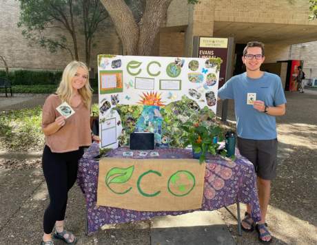 people posing with sustainability display