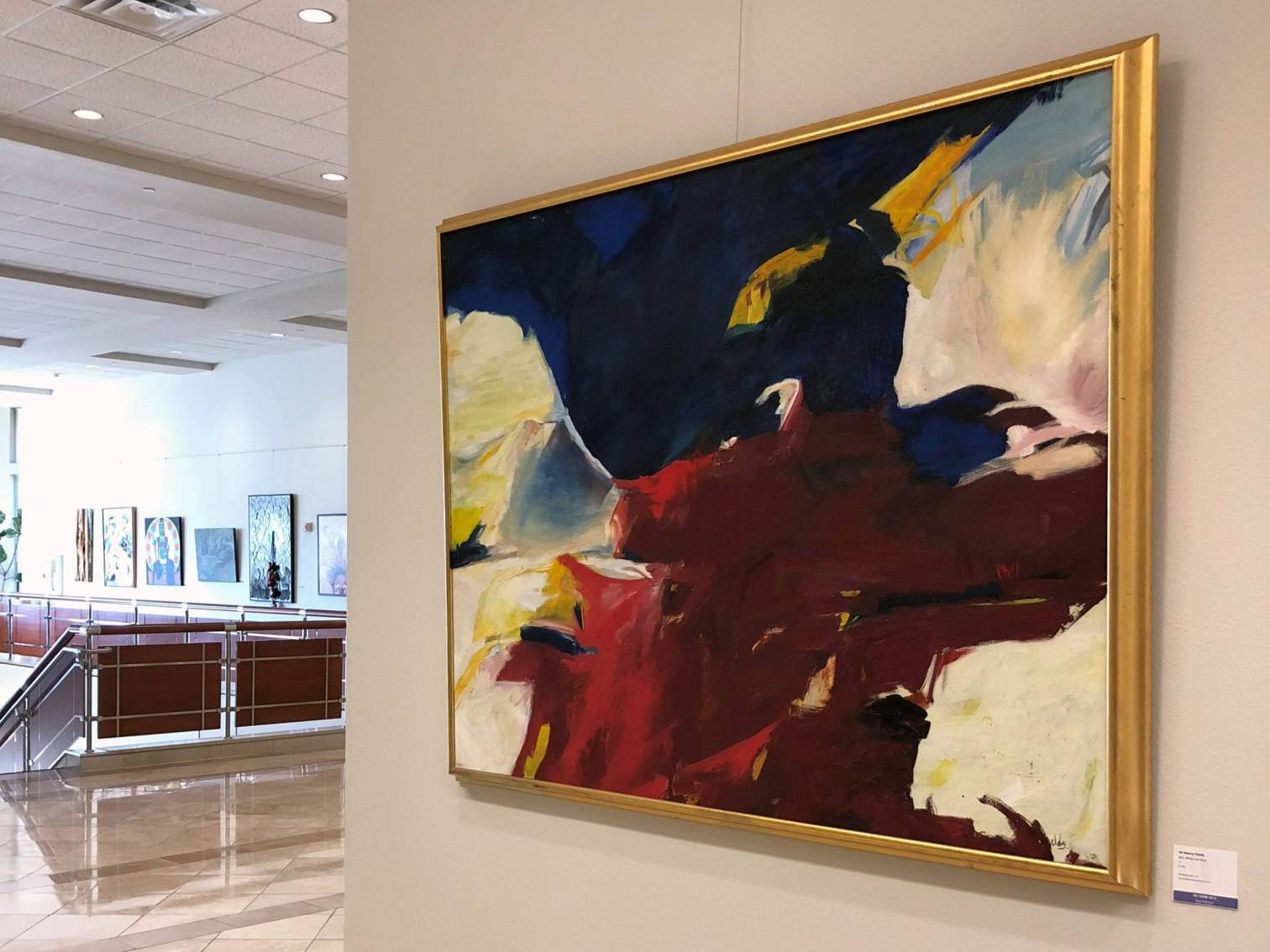 Paintings hanging in the Avery Building for an art exhibit