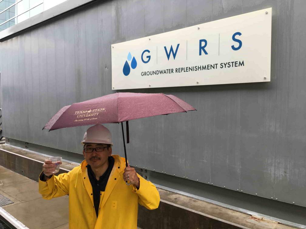 -	Dr. Ikehata drinking a glass of highly purified reclaimed water at OCWD GWRS in Fountain Valley, California