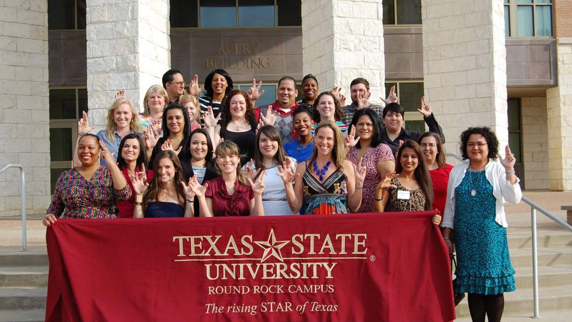 Students on the steps of the Avery Building at the Round Rock Campus.