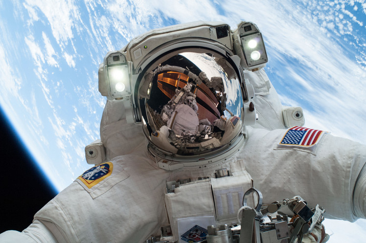 Astronaut in outer space with Earth in the background