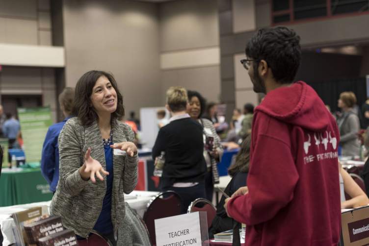 advisors talking with students at the 2016 grad fair