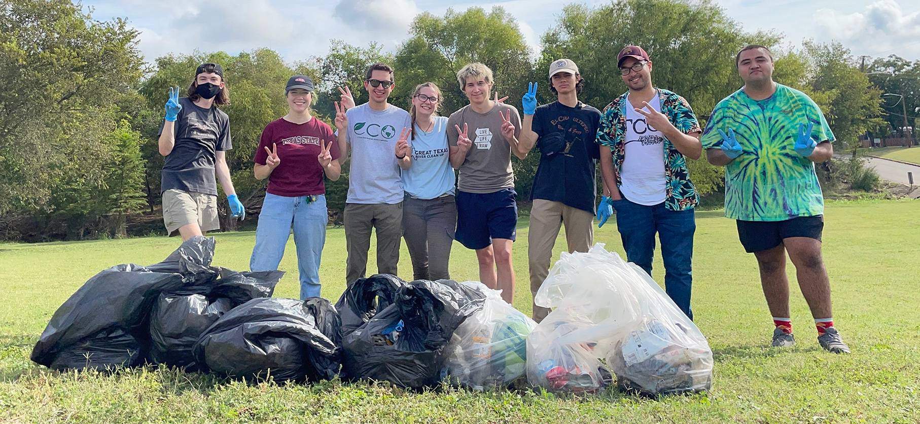 group of students with collected trash