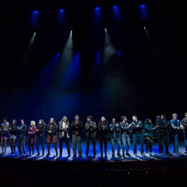 Full cast on stage singing seasons of love