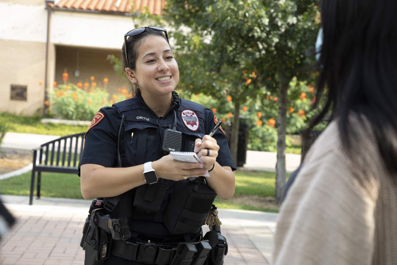 Officer Ortiz Smiling with Notepad