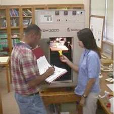 Image, students using 3D printer.