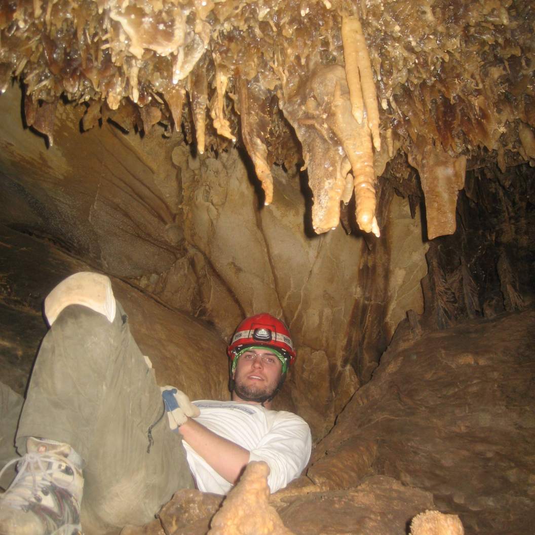 Chris takes a break during a caving trip
