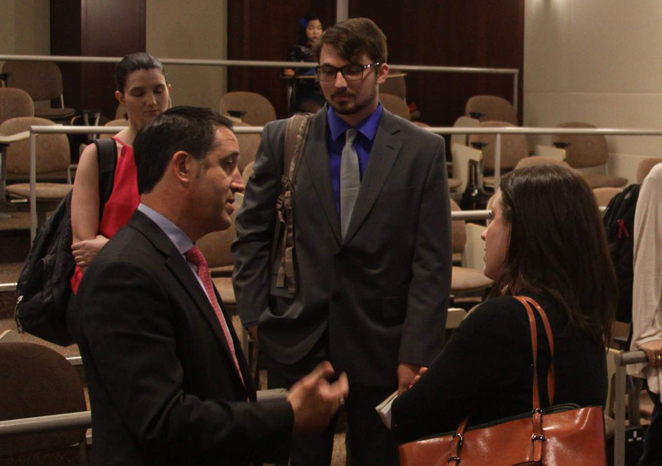 Comptroller Hegar speaking with students after the lecture