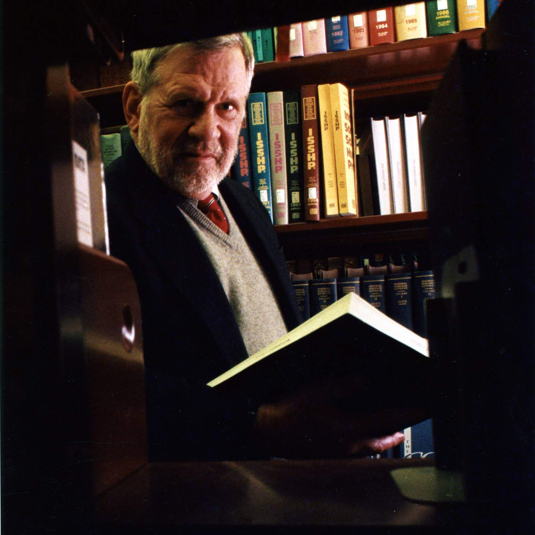 Bill Hobby standing in the stacks at Fondren Library at Rice University