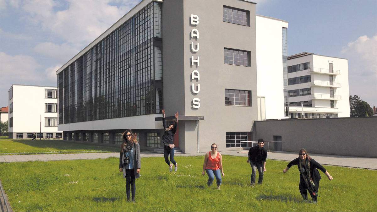 Students jumping in front of Bauhaus, Germany