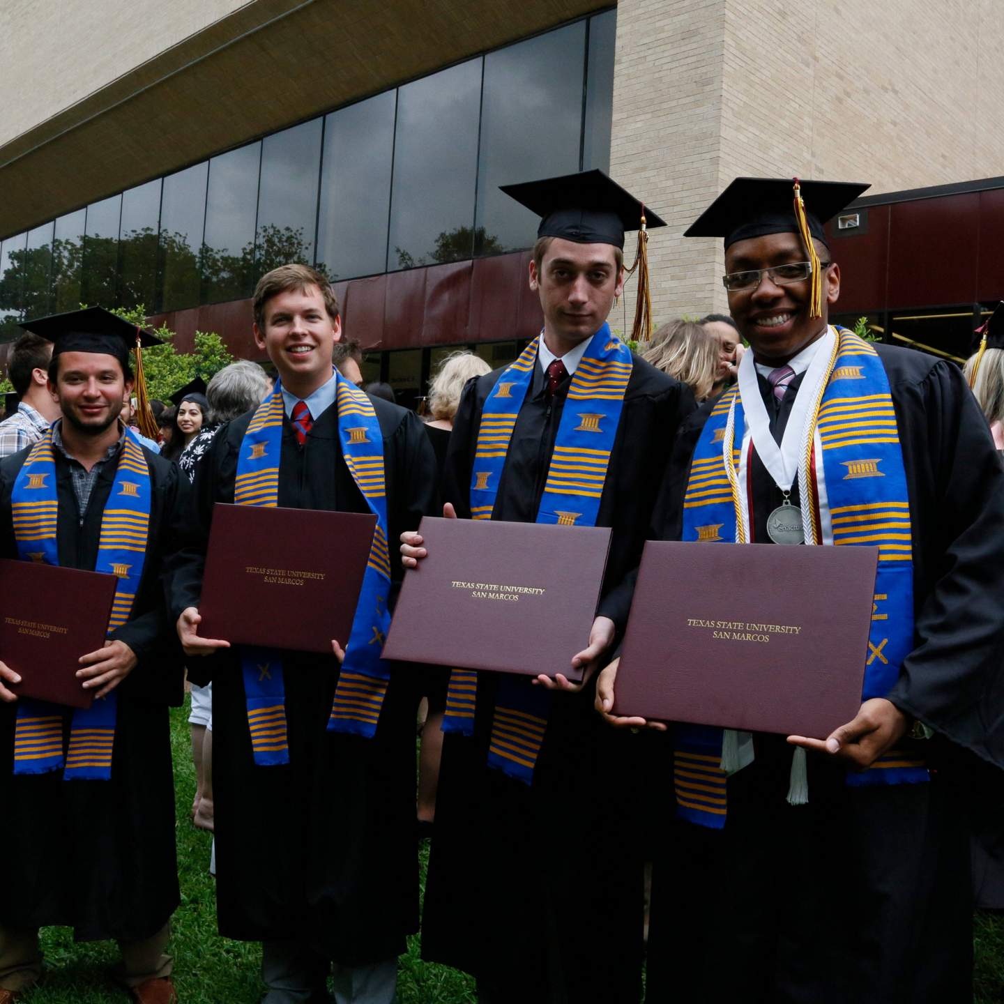 graduates with diplomas 