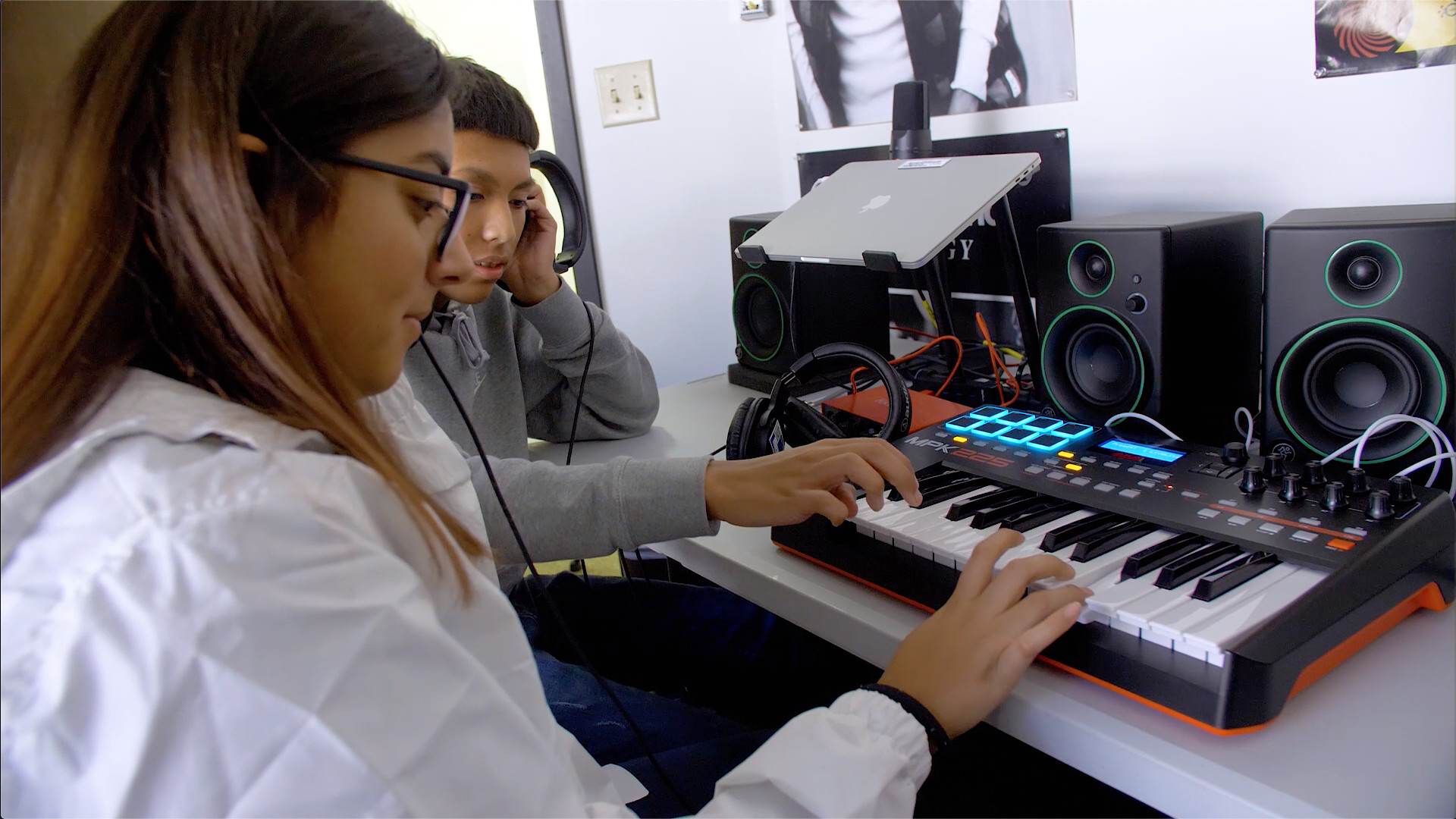 Students learning music production