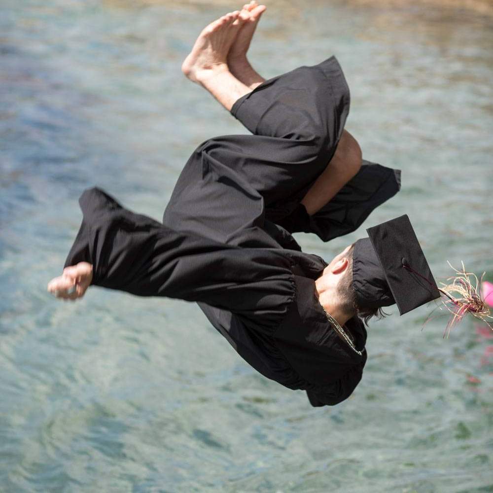 graduate flipping into the river