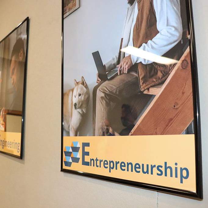 poster on wall reading "entrepreneurship" 