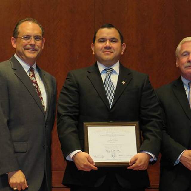 Joel Garcia (center) a graduate of the University of Texas at Pan American CPM Program conducted in Edinburg, Texas with UT Pan Am CPM Program Director John Milford (right) and CPM Graduation Speaker Mike Land.