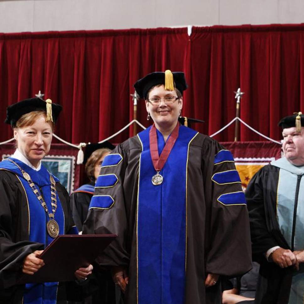 Doctoral Candidate receives diploma from President Trauth 