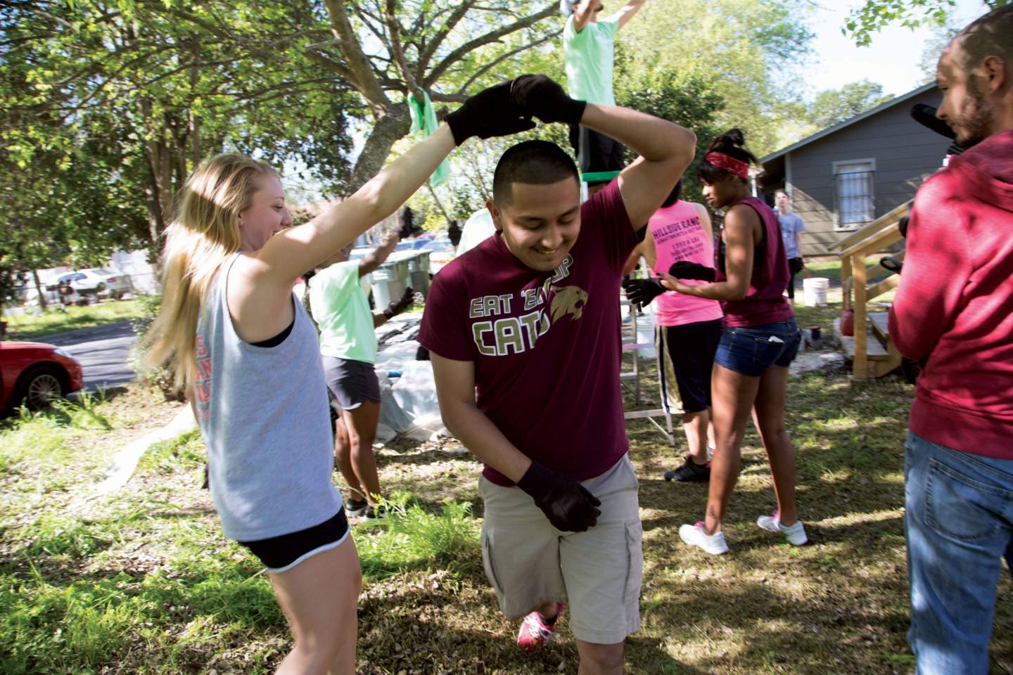Students dance and play during a campus clean-up event