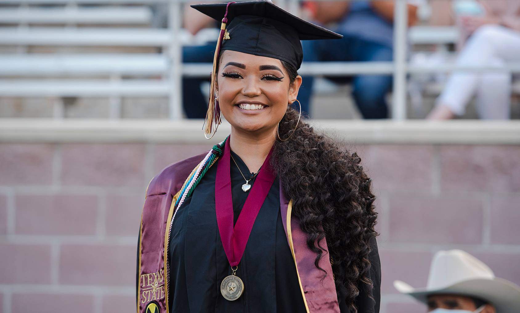 female graduate smiling