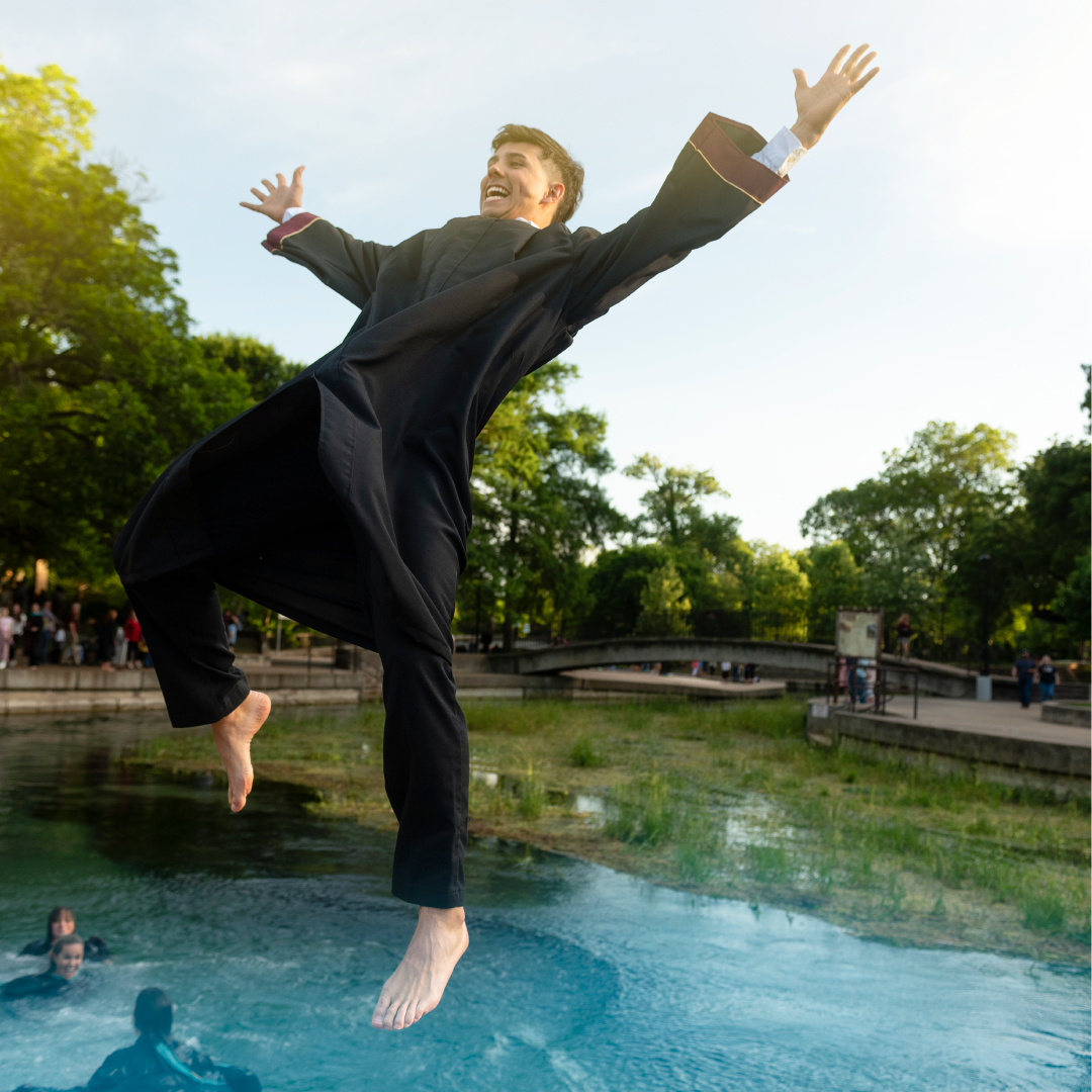A graduate jumps into the river in the first slide of a carousel of graduation photos