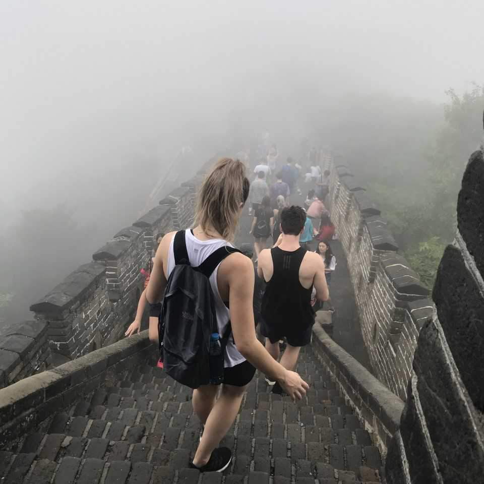 Image of students descending a staircase on the Great Wall of China