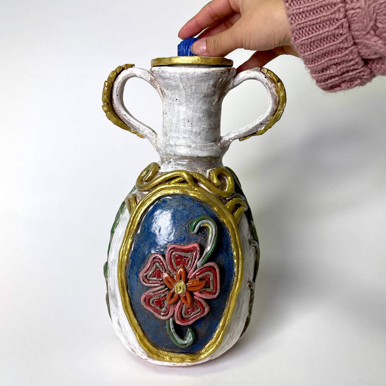 Student work: a vase with raised flower decoration