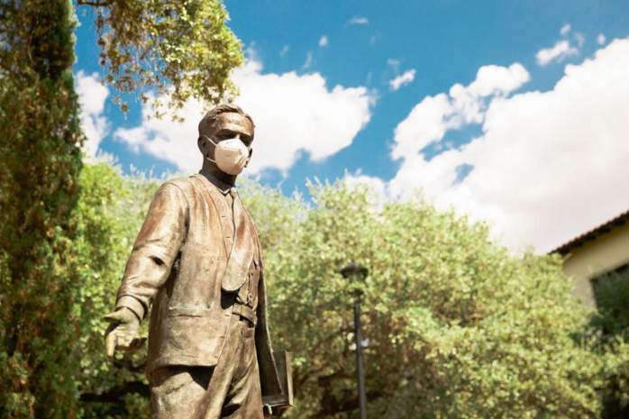 statue of lbj with mask