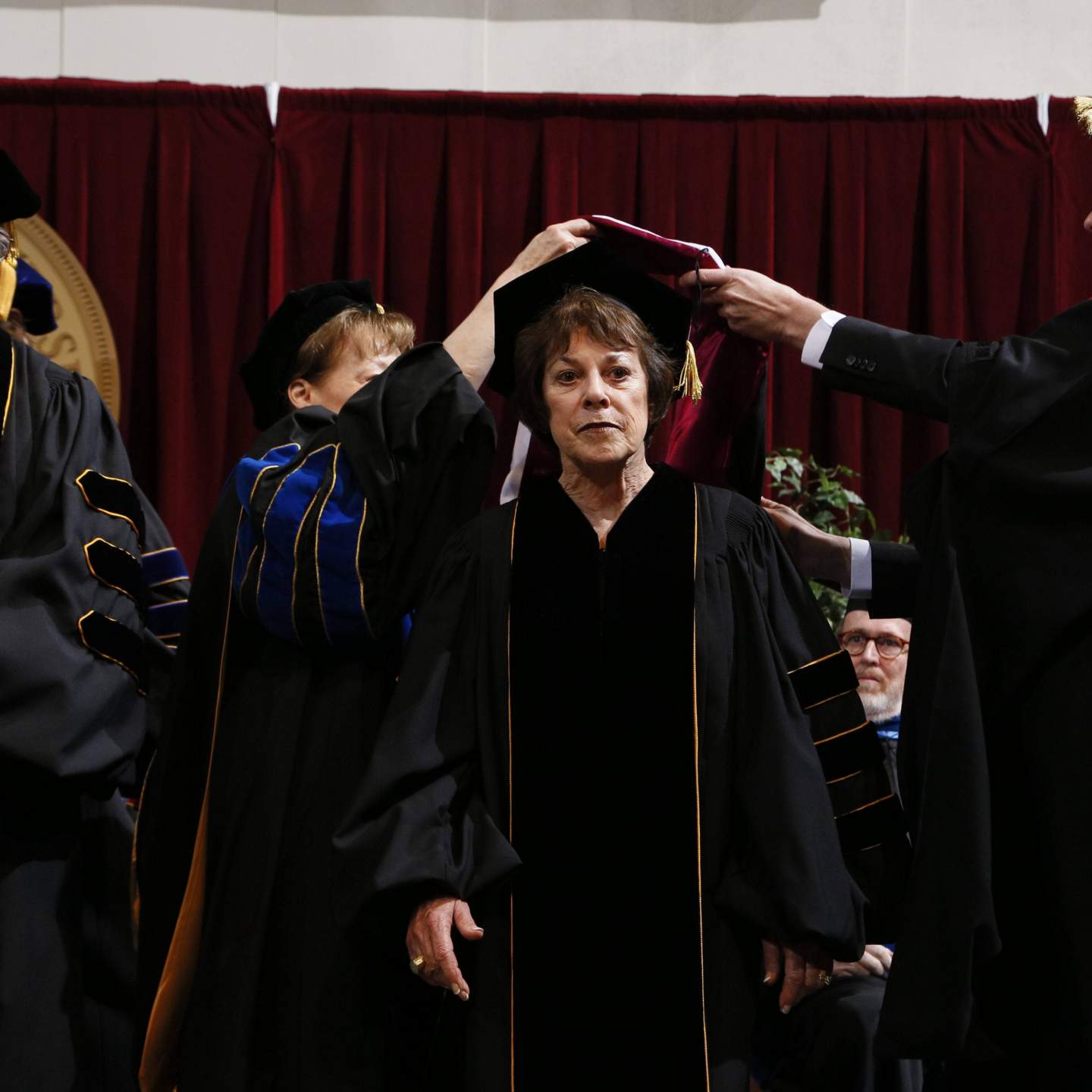 Sally B. Wittliff hooded by President Trauth and Provost Bourgeois