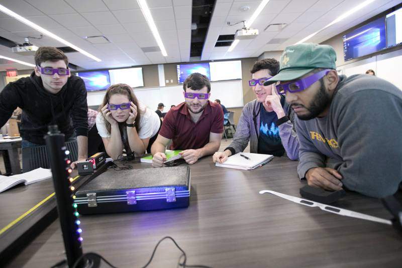 students solving problems with special glasses