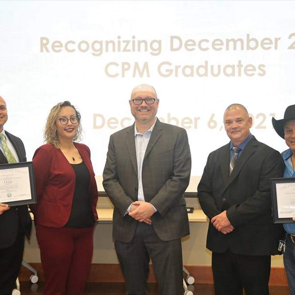 Texas State University CPM graduates pose with program Director Dr. Miha Vindis.