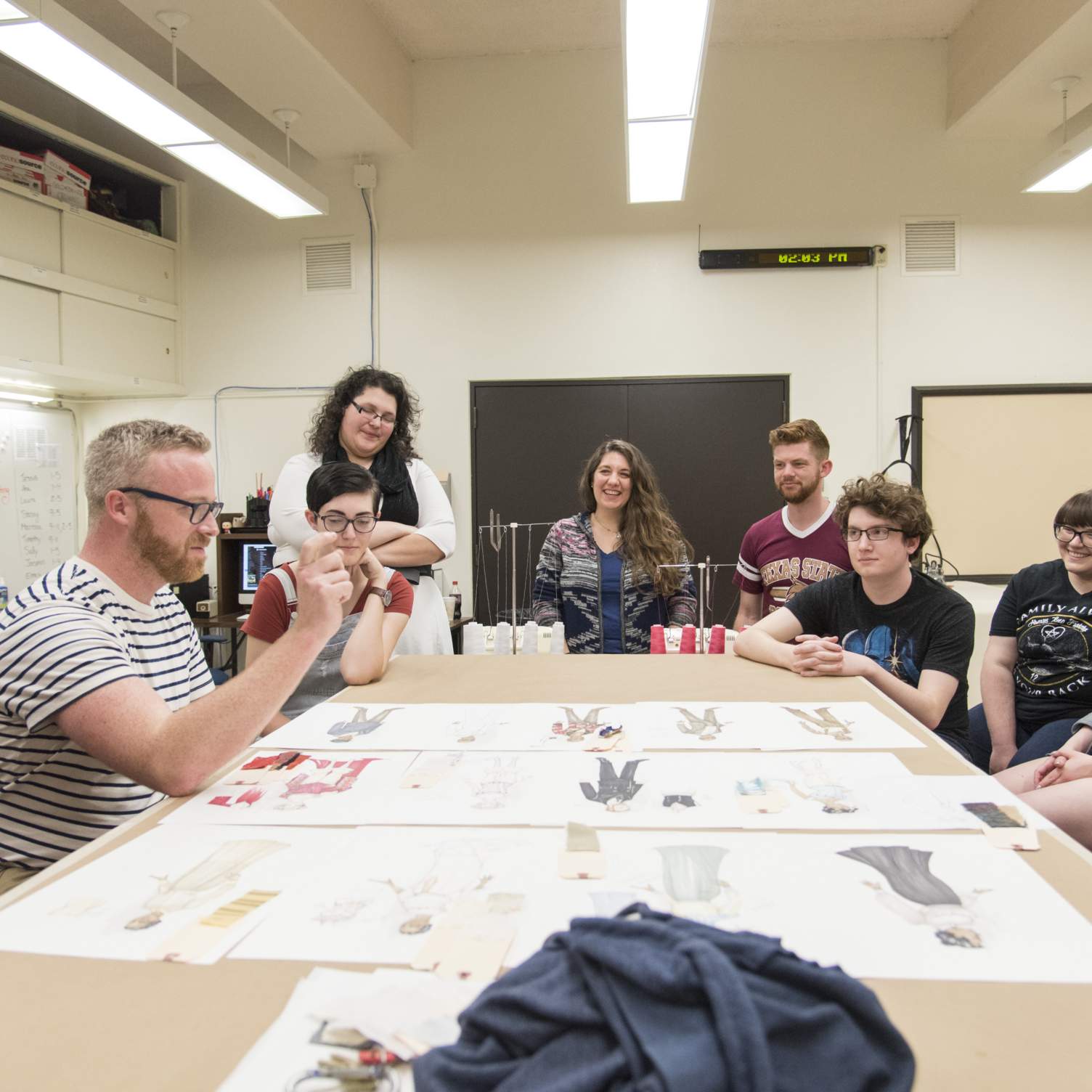 Professor discusses the details of Intimate Apparel during a costume design presentation.