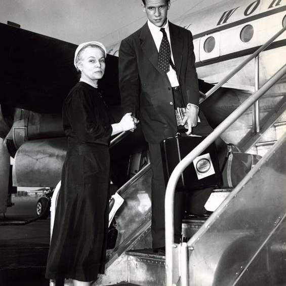 Bill Hobby and his mother, Oveta Culp Hobby, boarding an airplane