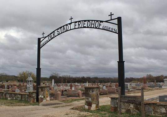 iron arch at opening of cemetery